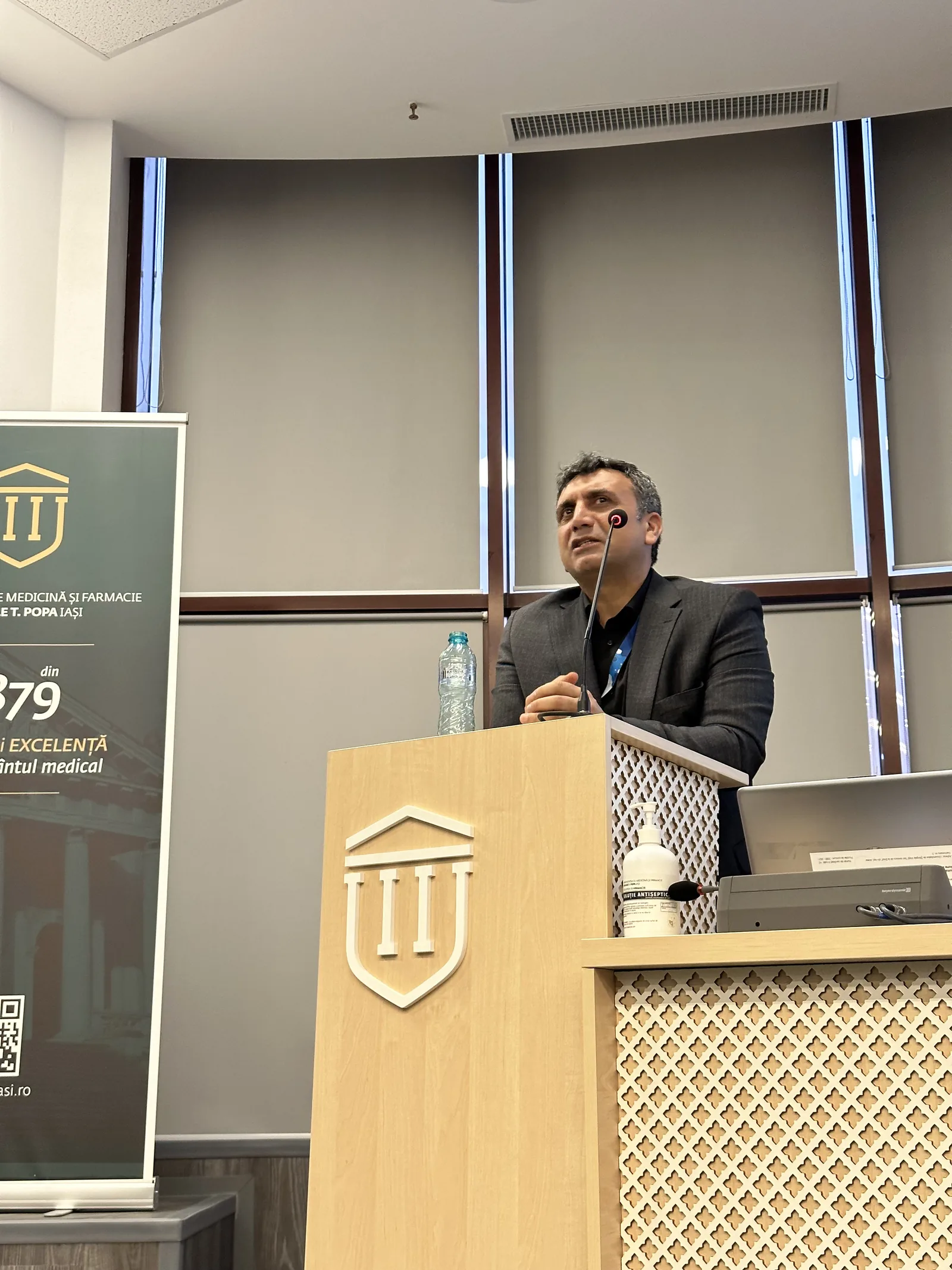 Dr. Arslan Musbeh lecturing on hair transplant surgery at a Romanian medical university