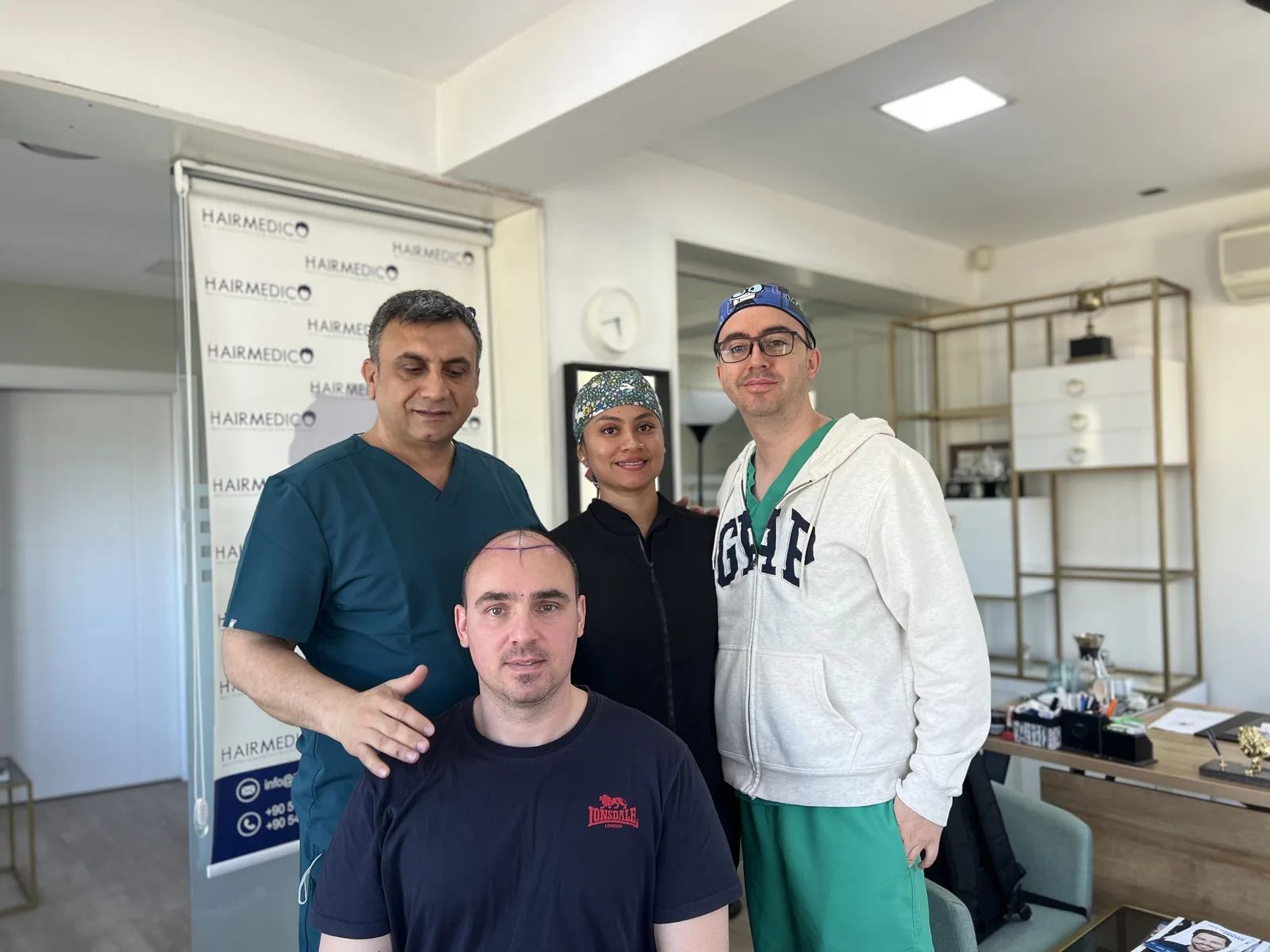 Dr. Arslan Musbeh and the Hairmedico team with a patient after the hairline has been drawn, before surgery