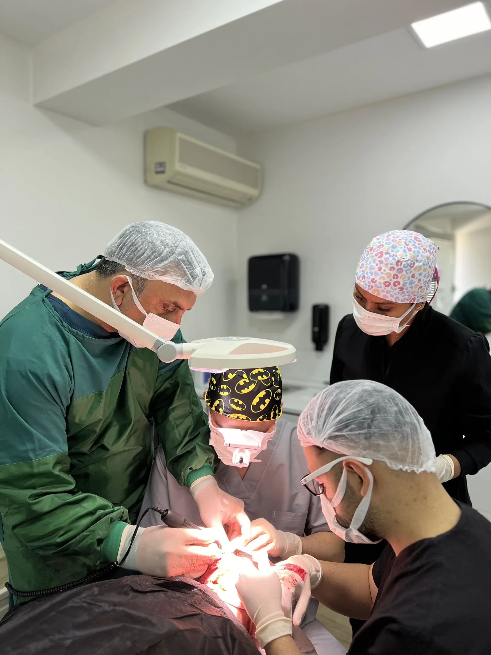 Hairmedico's clinical team during an FUE procedure at the Levent, Istanbul facility inspected under Turkey's health tourism authorisation