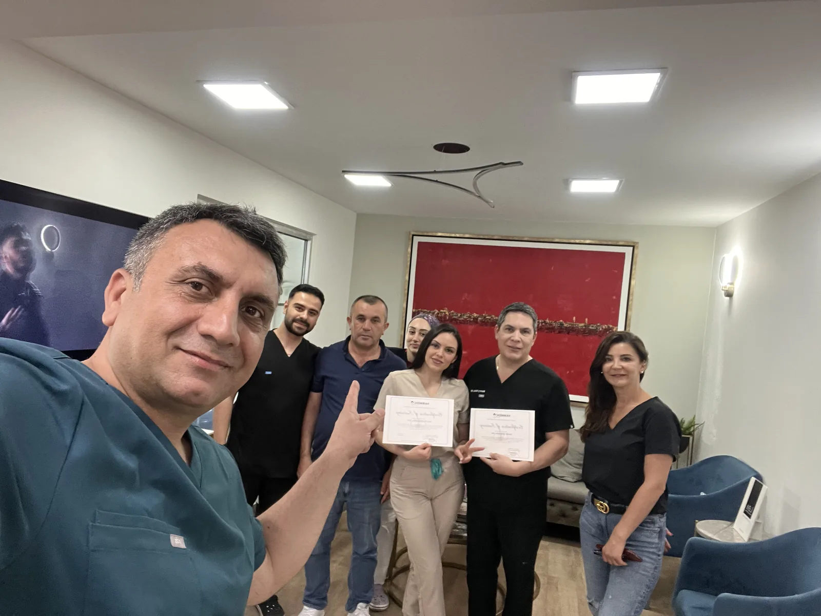 Dr. Arslan and the Hairmedico clinical team holding FUE-method training certificates at the Istanbul clinic