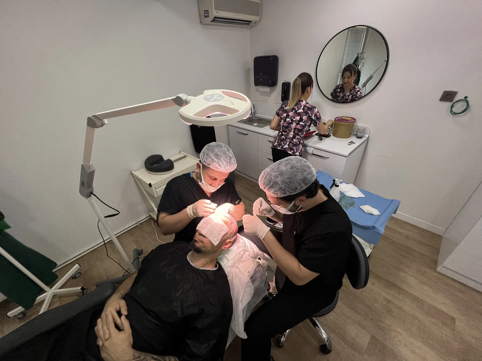 Hairmedico's surgical team performing a DHI implantation session in Istanbul