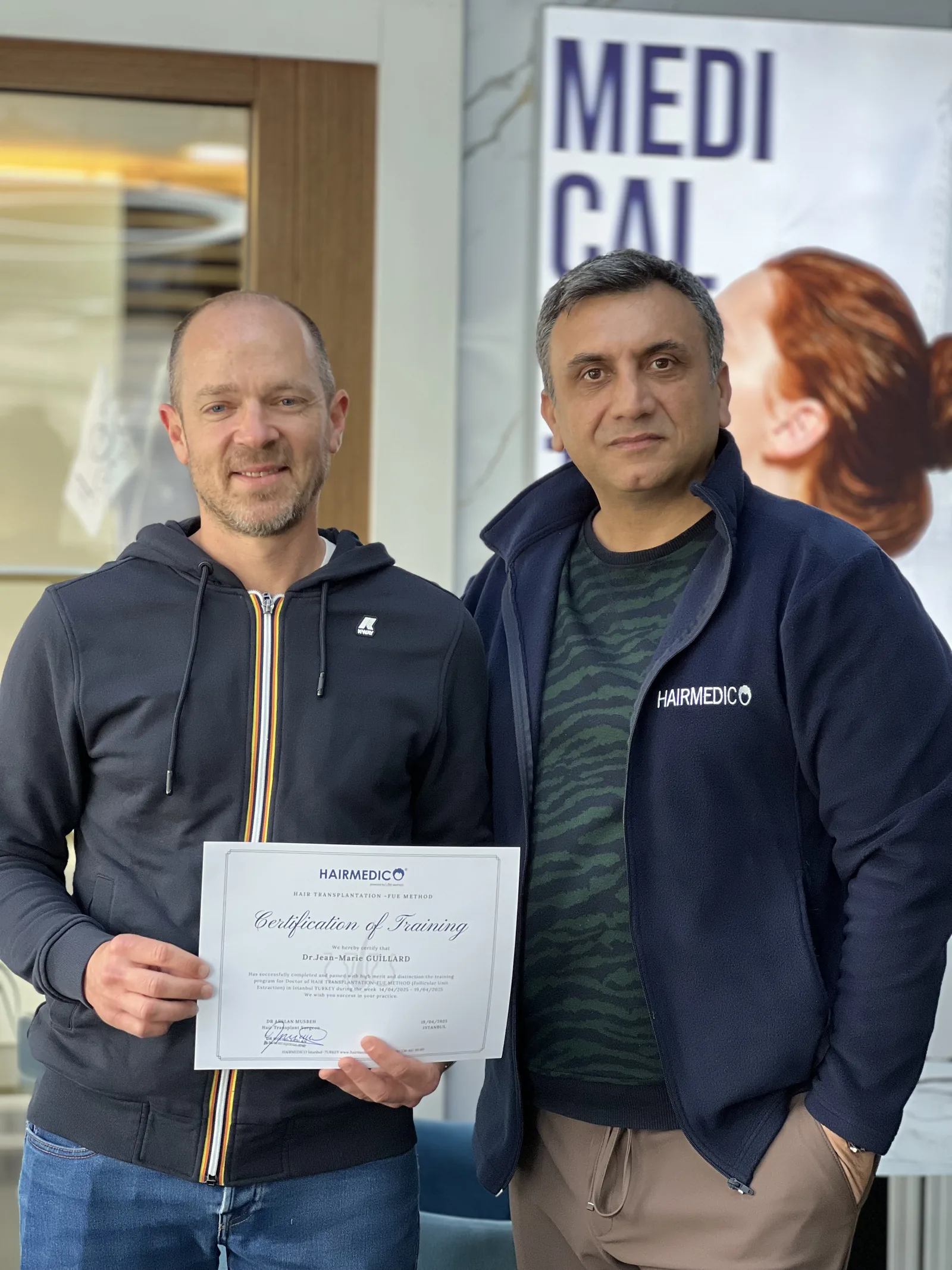 Certification ceremony — Dr. Arslan Musbeh presenting a diploma
