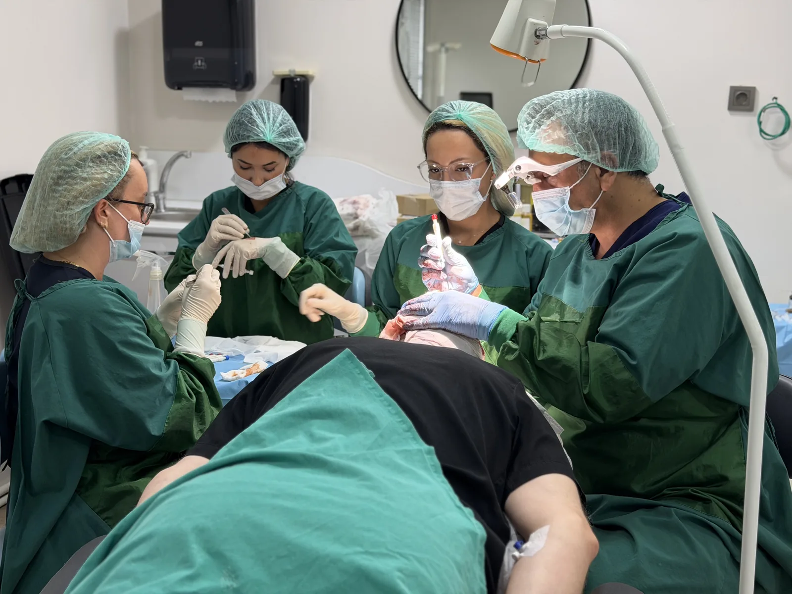 Hairmedico's full surgical team working together on a single hair transplant patient in Istanbul