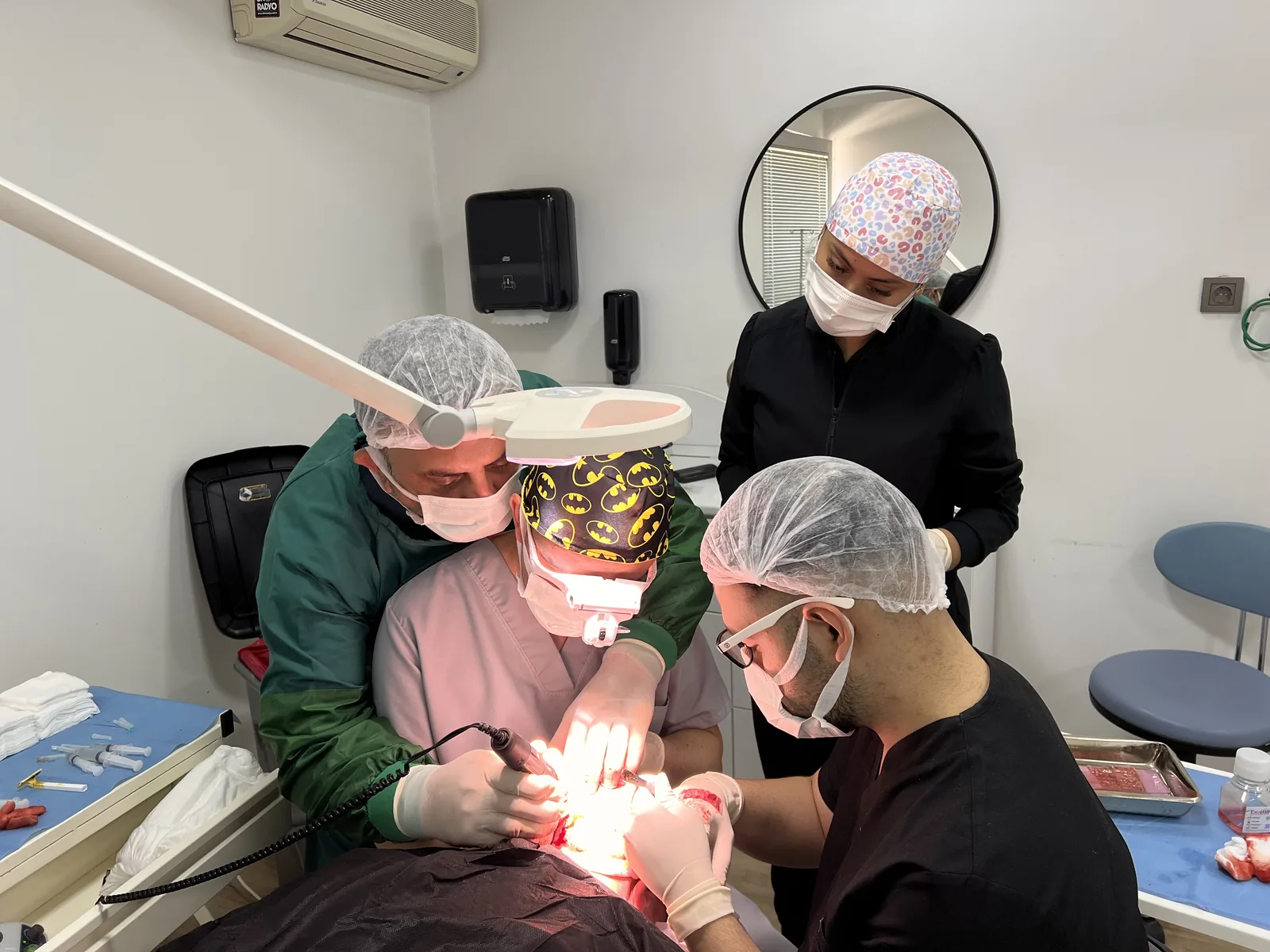 Hairmedico's full clinical team collaborating during a hair transplant procedure in the treatment room inspected under Turkey's health tourism regulation