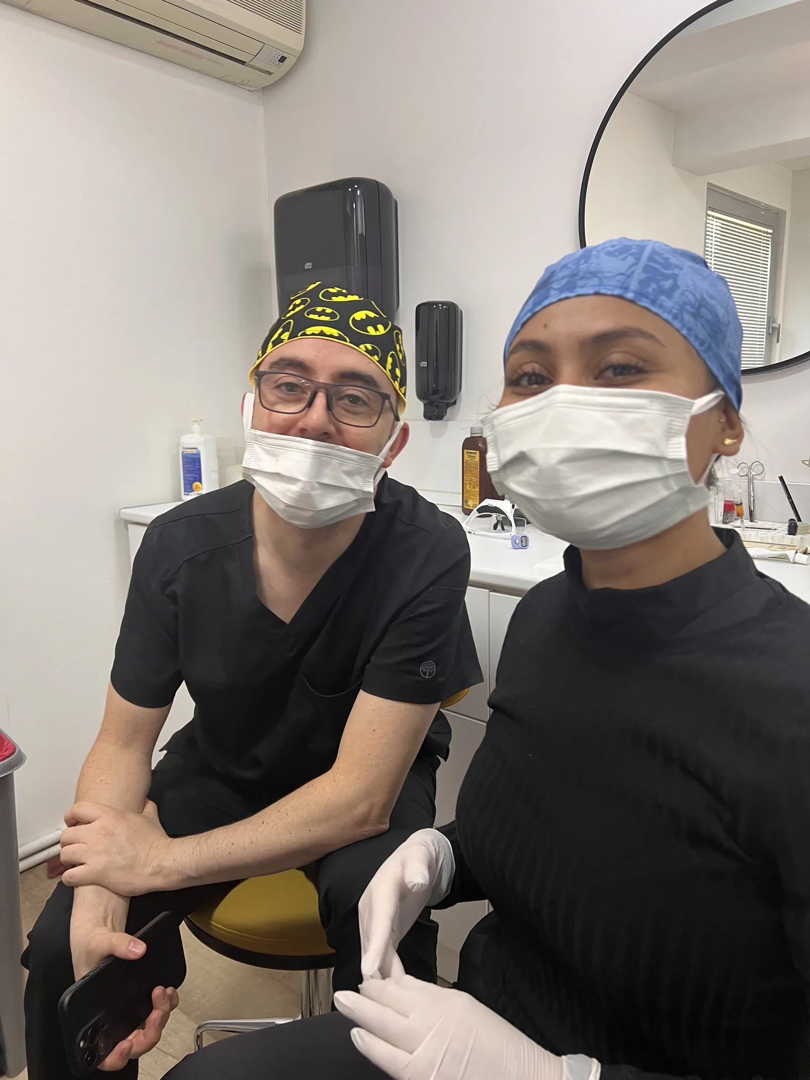 Hairmedico surgical team members in masks and caps in the operating room