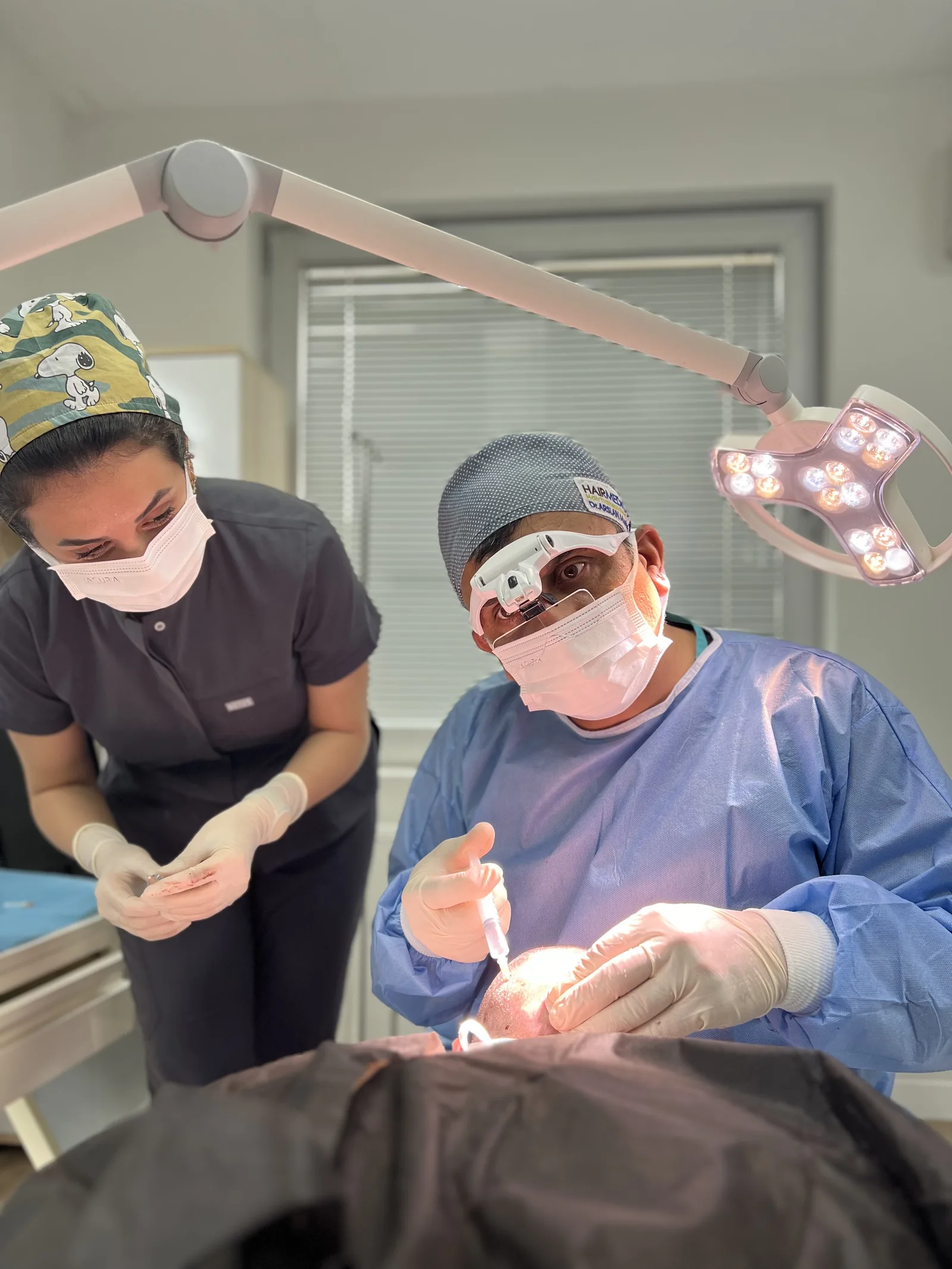 Dr. Arslan and his surgical team preparing the scalp before extraction at Hairmedico Istanbul
