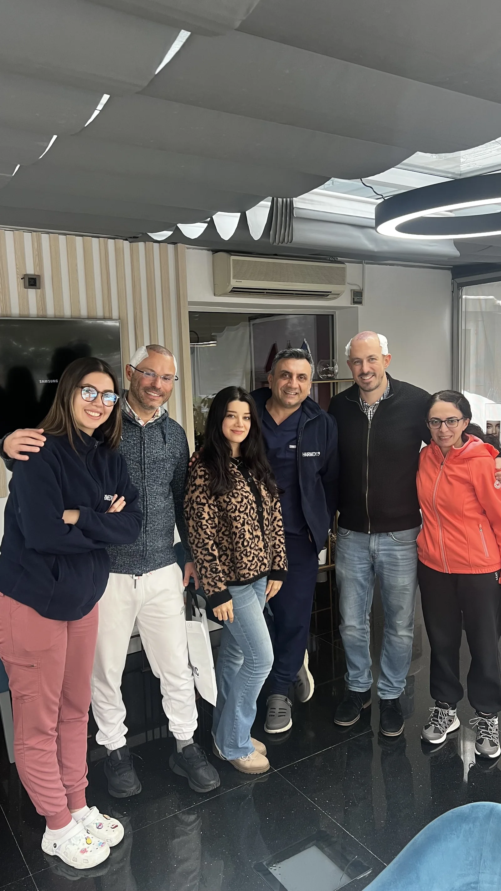 The Hairmedico team with two post-op patients and companions at the Levent clinic in Istanbul
